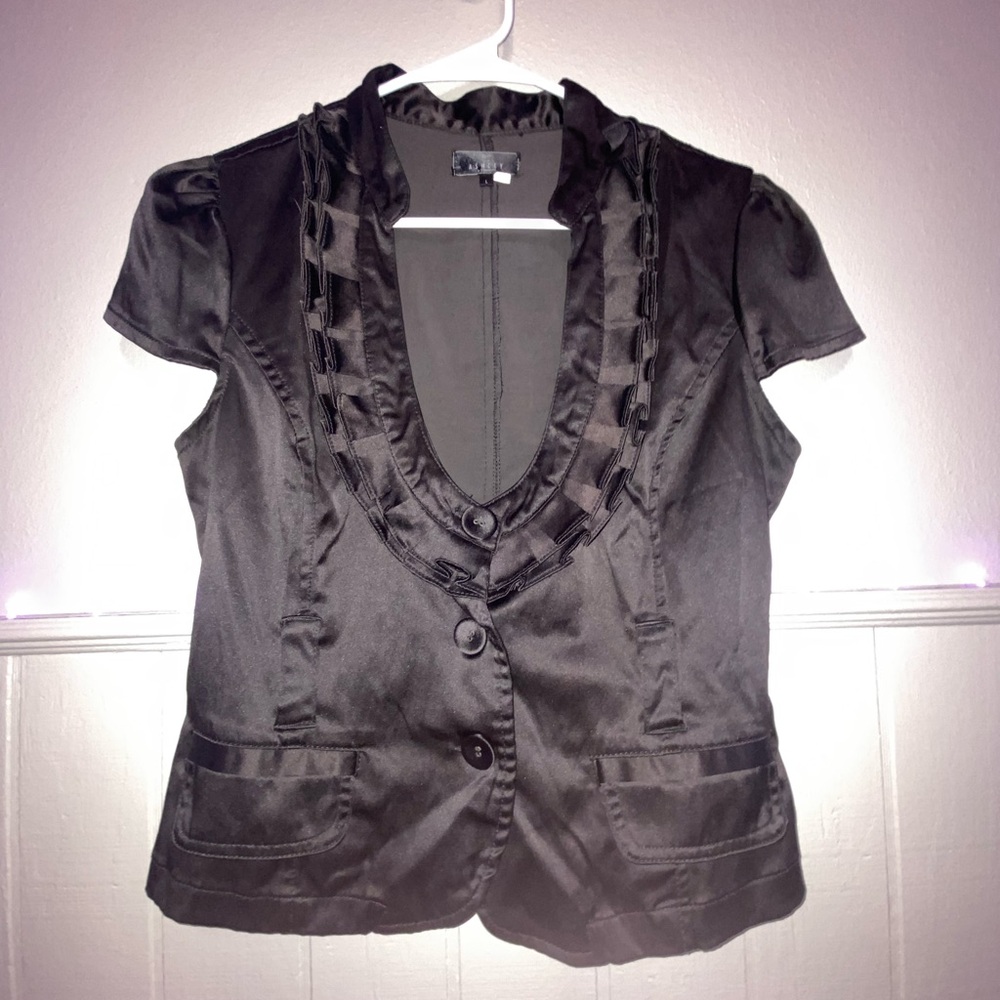 Black cardigan with pockets and front button.